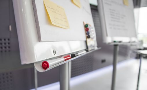 bottom of white boards and sticky notes